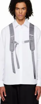 Athlete wearing a tight moisture-wicking shirt with the shoulder straps of a backpack resting against the upper back and shoulders.