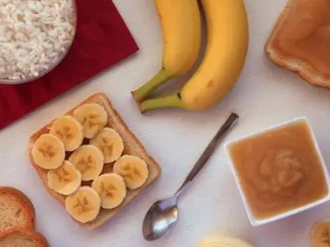 Plate with plain crackers, a slice of dry toast, and a small portion of plain white rice