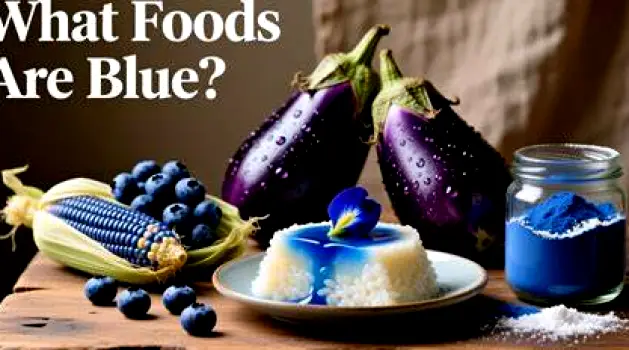 Display of blue raspberry candies, a sports drink bottle, blueberries, grapes, and popsicles on a kitchen counter