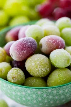 A small bowl of frozen grapes.