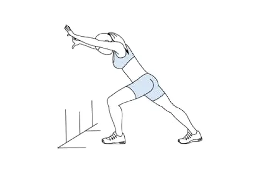 Person standing and performing a calf stretch against a wall