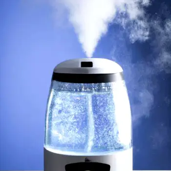 A clear glass of distilled water placed beside a household humidifier