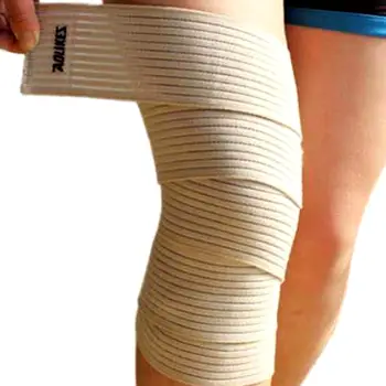 Close-up of a knee wrapped snugly with an elastic compression bandage