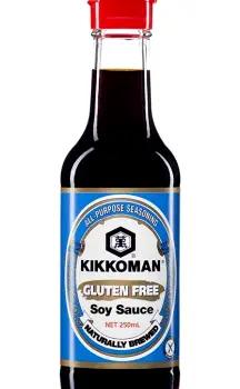 Bottled Kikkoman gluten-free soy sauce showing the label with ingredients water, soybeans, rice, and salt, and a gluten-free certification mark.