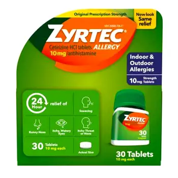 Person looking drowsy while holding a Zyrtec bottle