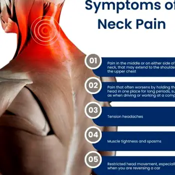 A person sitting with their eyes closed, pressing their hand against the back of their head and upper neck in discomfort.