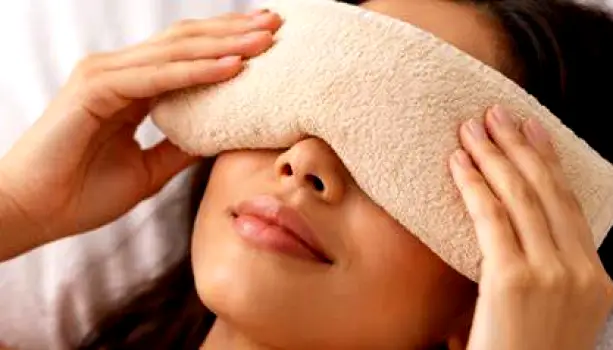 Person resting comfortably with a warm compress