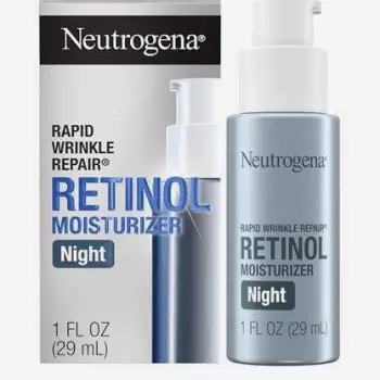 Person gently applying a thin layer of topical cream to their face at bedtime