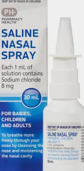 A bottle of saline nasal spray and a box of tissues resting on a table