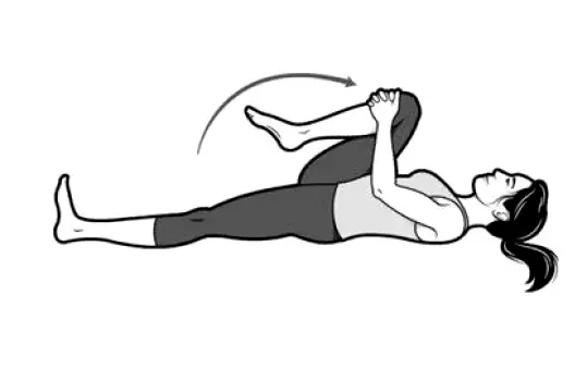 Person lying on back bringing one knee toward chest and holding the position